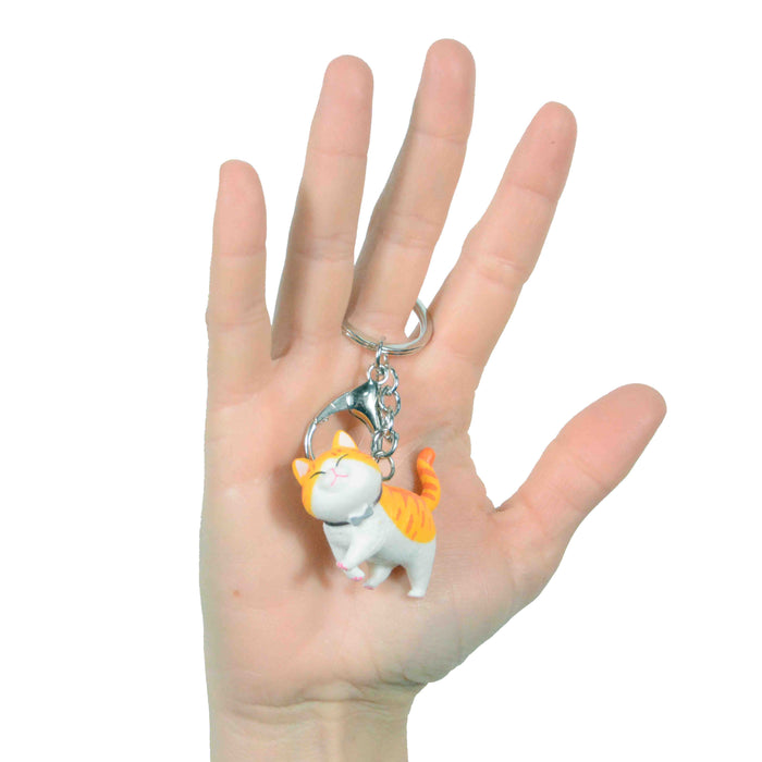 portada gato llavero blanco amarillo plastico colgante metal