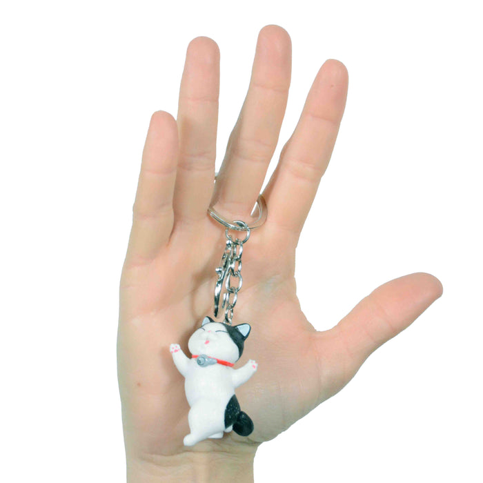 portada gato llavero blanco negro bailando plastico colgante metal