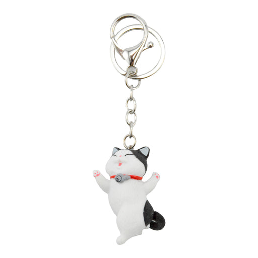 gato llavero blanco negro bailando plastico colgante metal